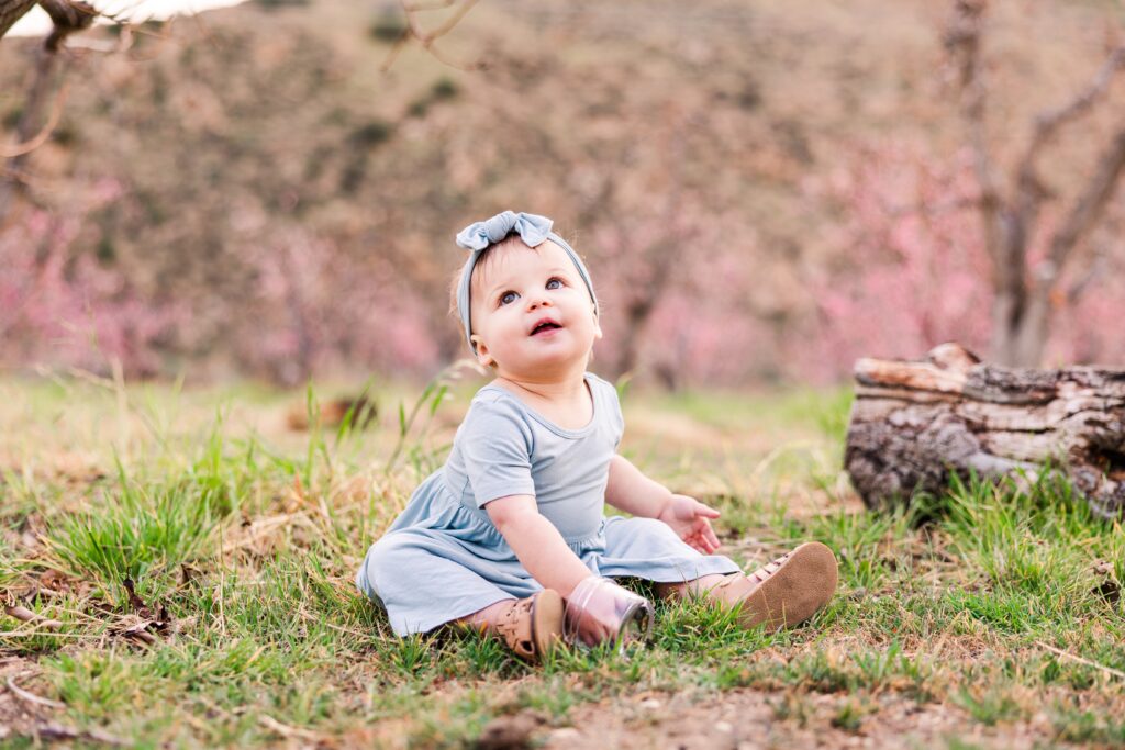 Girl smiling and eating snacks during family photoshoot near Santa Clarita, California