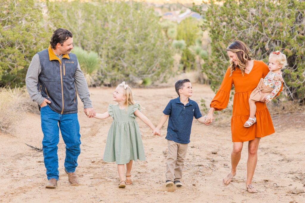 Happy family walking together during family photoshoot in Palmdale, California