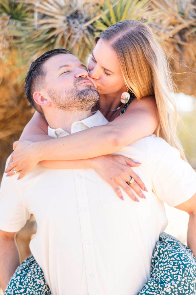 Engaged couple kisses at Joshua Tree, California