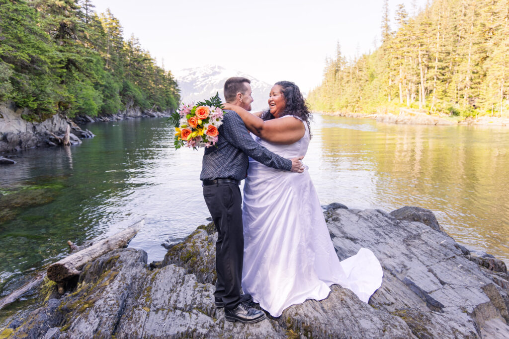 Couple eloping in front of mountain and lake in Whittier, Alaska