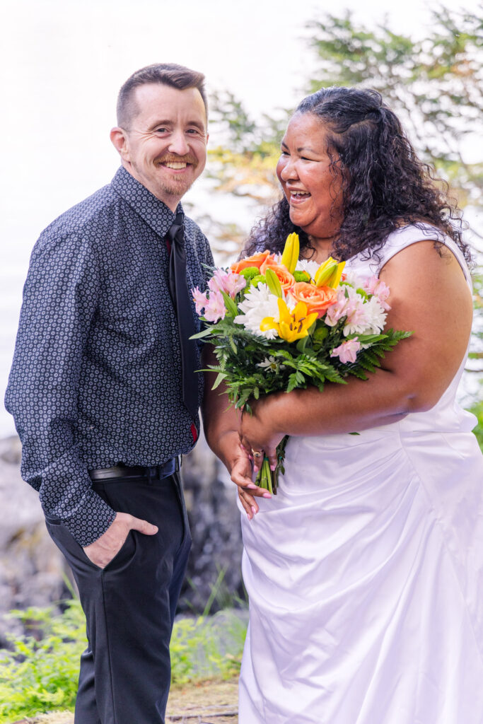 Couple eloping in front of mountain and lake in Whittier, Alaska