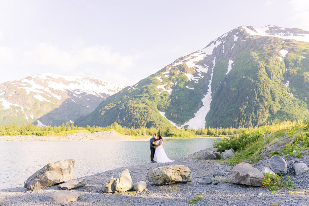 Couple eloping in front of glacier and mountain in Whittier, Alaska