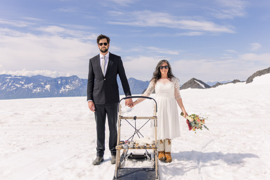Wes Anderson-inspired couples portraits with dogsled in Alaska