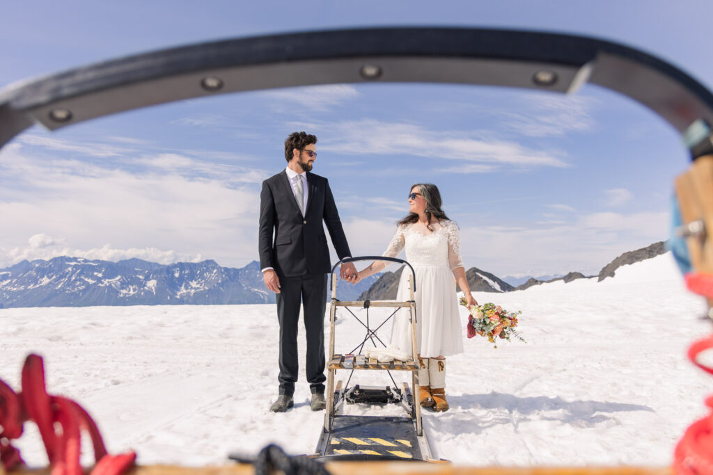 Wes Anderson-inspired couples portraits with dogsled in Alaska