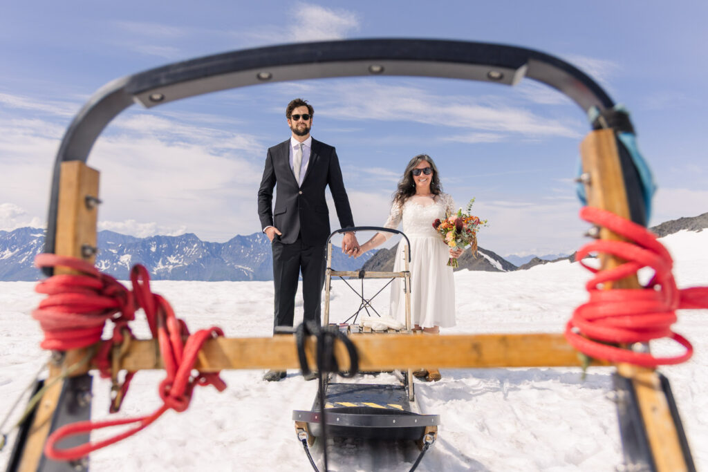 Wes Anderson-inspired couples portraits with dogsled in Alaska