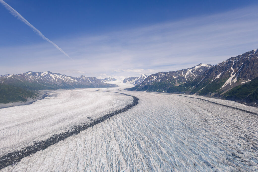 Helicopter flight over glacier terrain during Alaska elopement adventure