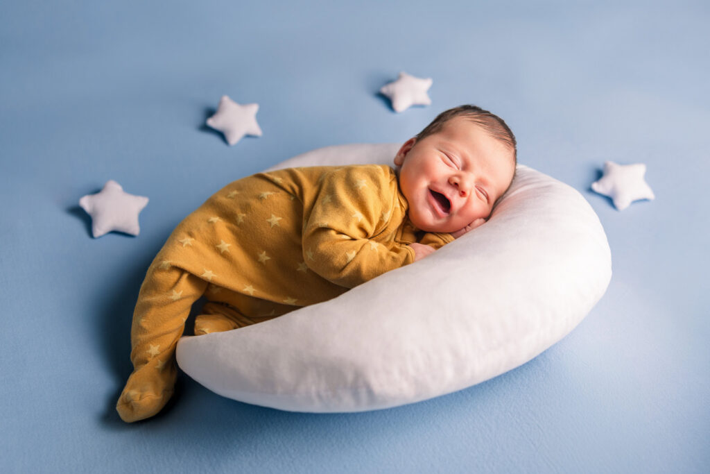 newborn with stars and moon props during studio session