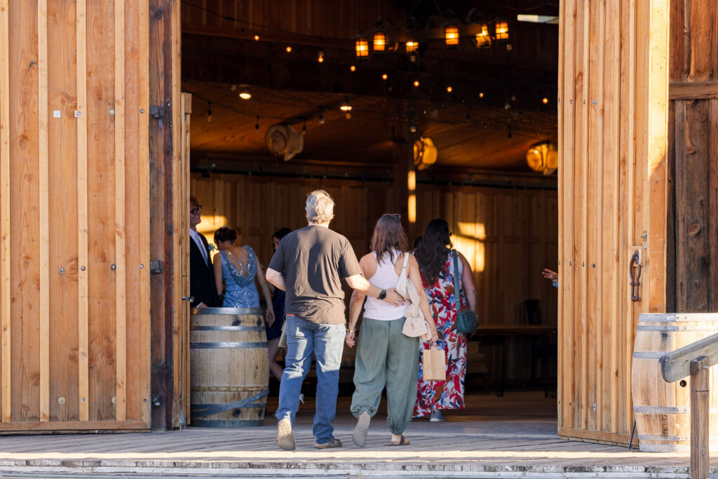David and Lisa entering the rustic Soundstage beneath its warm interior string lights.